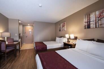 Отель Guest Inn & Suites  Midtown Medical Center