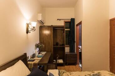 تختخواب و صبحانه Wuzhen Nanyan Muyun Homestay