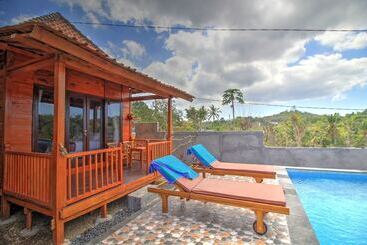 تختخواب و صبحانه Raja Bungalow By Wizzela