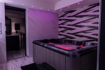 Appart Hotel Glam88 Suites Avec Spa Et Sauna Privatif