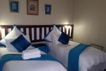 تختخواب و صبحانه Obrigado Guest House
