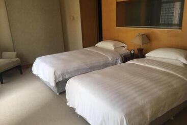 هتل Dalian Asia Pacific Service Apartment