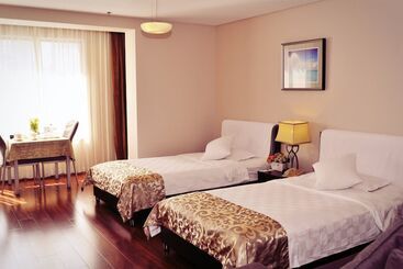 هتل Qingdao Housing International