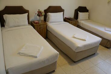 Al Alya Hotel Rooms And Suites