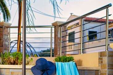 هتل Theos Village Apartments