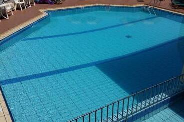 هتل Theos Village Apartments