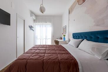 تختخواب و صبحانه Cas’ A Mare   Beachfront Luxury Suites