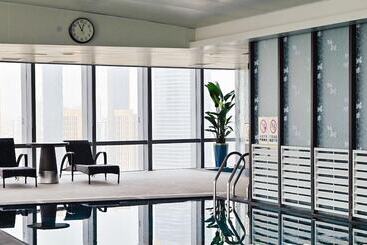 هتل Grand Madison Qingdao Harbourview Central（former Qingdao Farglory ）