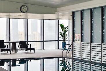 هتل Grand Madison Qingdao Harbourview Central（former Qingdao Farglory ）