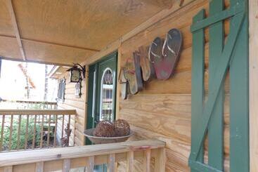 Lake View Two Bedroom, Two Bath Log Sided Cottage With Private Hot Tub Overlooking Lake Ouachita. By