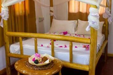 تختخواب و صبحانه Jambiani Wood House