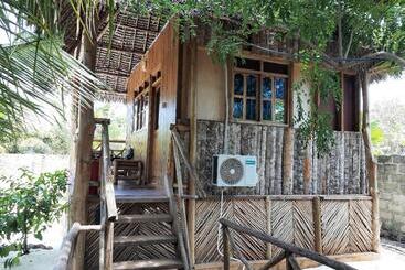 تختخواب و صبحانه Jambiani Wood House