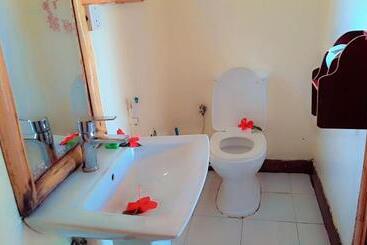 تختخواب و صبحانه Jambiani Wood House