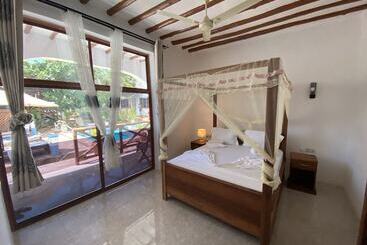 هتل Utulivu Bungalow