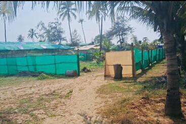 هتل Om Beach Cottages