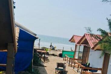 هتل Om Beach Cottages