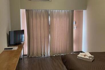 هتل Progress Inn 名護 Matabee