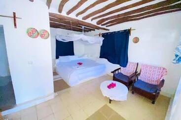 تختخواب و صبحانه Bwejuu Garden View Bungalows