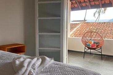 تختخواب و صبحانه Suítes Aqui é Seu Lugar Itaguá