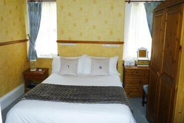 تختخواب و صبحانه The Norman Guest House