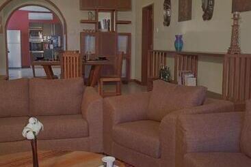 Cowrie Shell Beach Apartments Official