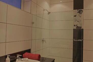 Cowrie Shell Beach Apartments Official