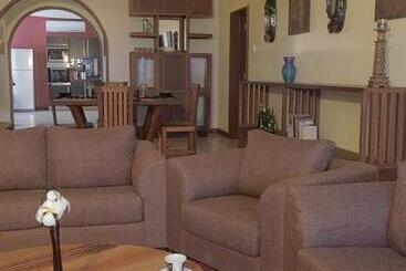 Cowrie Shell Beach Apartments Official