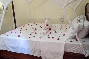 تختخواب و صبحانه Kua Garden Cottage
