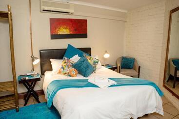 تختخواب و صبحانه Riverbank Lodge