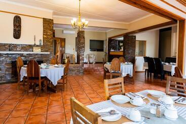 تختخواب و صبحانه Riverbank Lodge