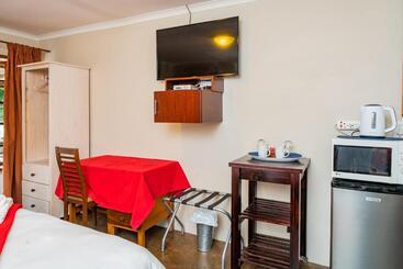 تختخواب و صبحانه Riverbank Lodge