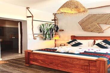 تختخواب و صبحانه Pili Pili Beach Bungalows