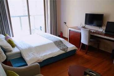 هتل Yumi Apartment Pujun Station Branch