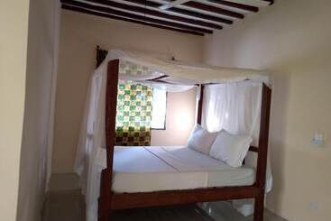 تختخواب و صبحانه Mpole Bungalows