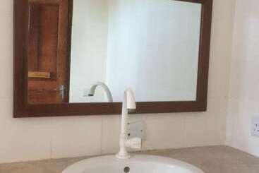 تختخواب و صبحانه Mpole Bungalows