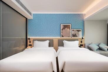 هتل Country Inn & Suite By Radisson, Guangzhou Railway Station Xiaobei