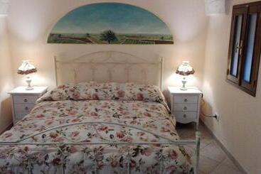 تختخواب و صبحانه Archetto Bianco
