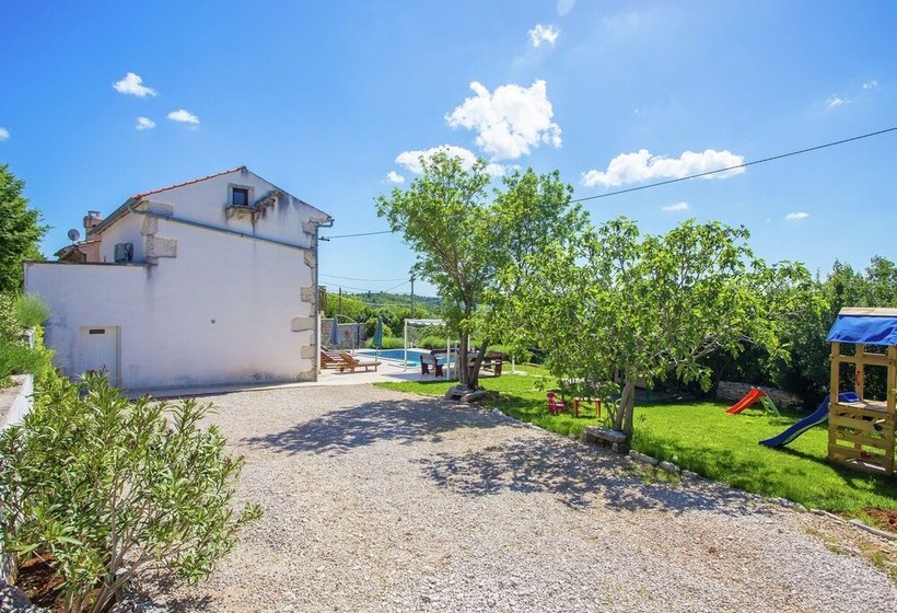 Surrounded By Beautiful Mediterranean Vegetation And The Crystal Clear Sea