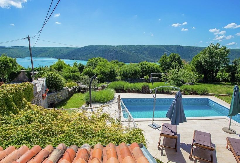 Surrounded By Beautiful Mediterranean Vegetation And The Crystal Clear Sea