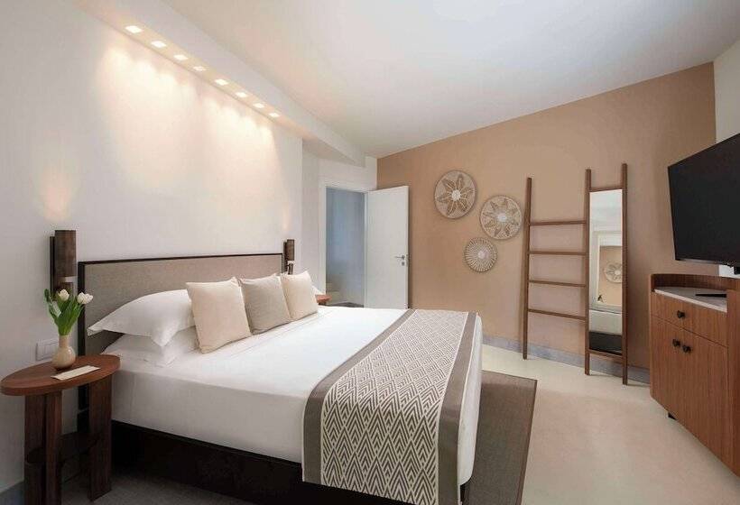 Отель Baia Di Chia Resort Sardinia, Curio Collection By Hilton
