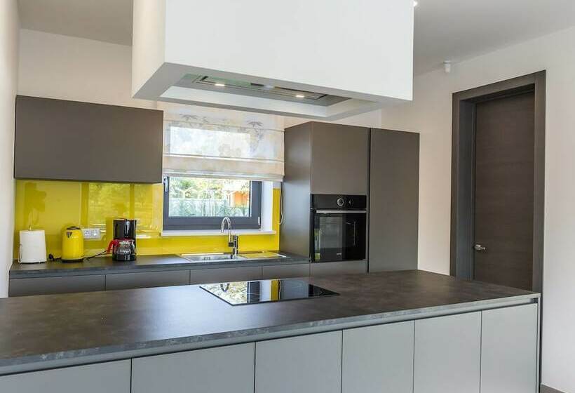 A Modern Luxury Villa With A Crystalclear Swimming Pool And Cultivated Garden