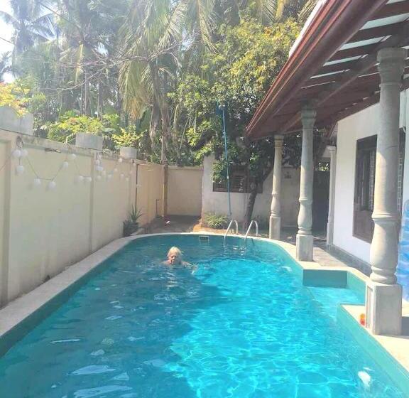 تختخواب و صبحانه Mango Tree House