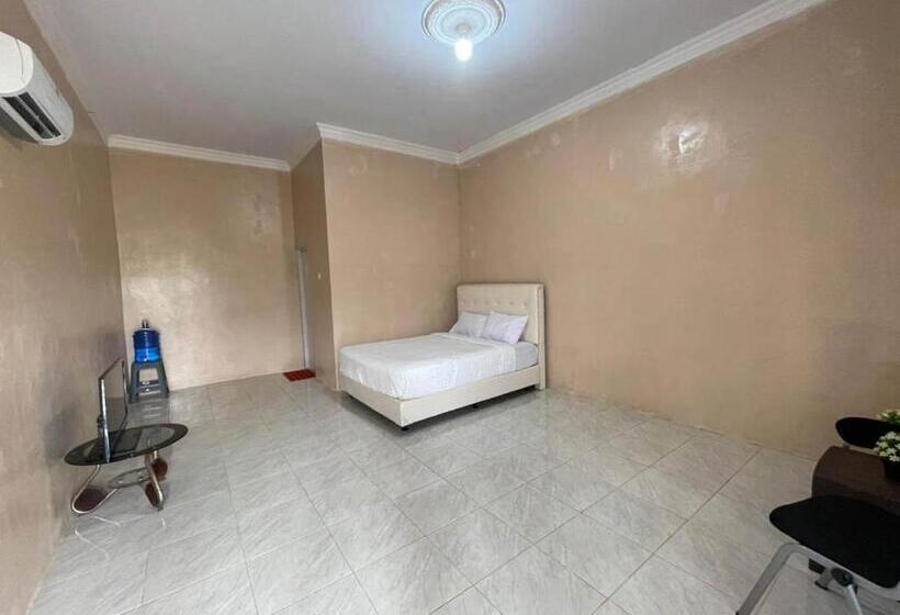 Отель Oyo 93033 Mutiara Homestay Syariah