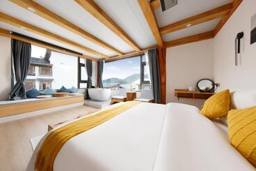 تختخواب و صبحانه Shangri La Jiangyue Beiting Boutique Homestay