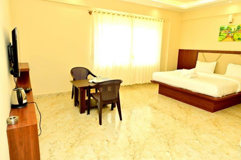 בית מלון כפרי Downtown Pr Groups Raashi Residency