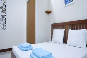 هتل Capital O 75521 Sang Siri Apartment