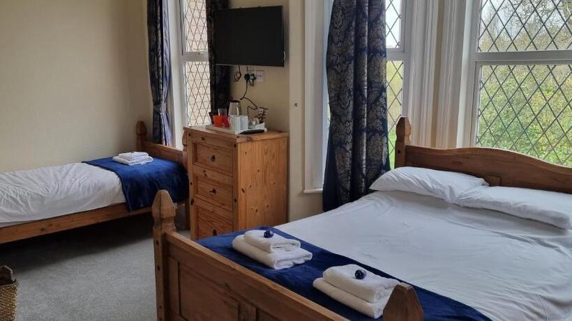 Chambre Triple Deluxe Vue Mer, Rowcroft Lodge