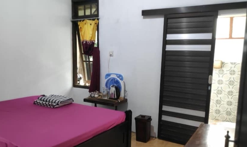 Кровать в Общей Комнате, Homestay Rahayu