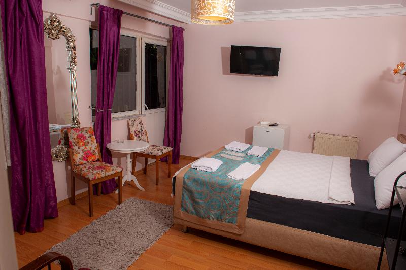 اتاق استاندارد سه تخته با چشم‌انداز باغ, Yesim Suites