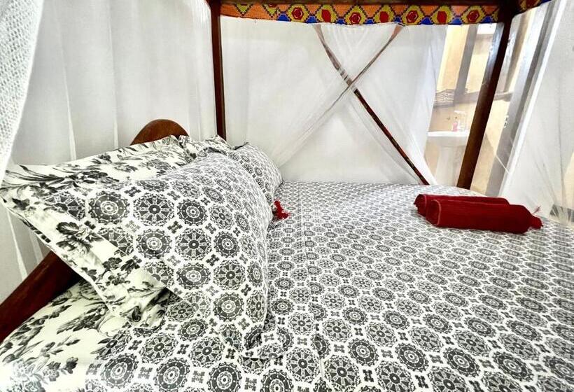 اتاق استاندارد چهارنفره با چشم‌انداز باغ, Chikachika Beach B&b